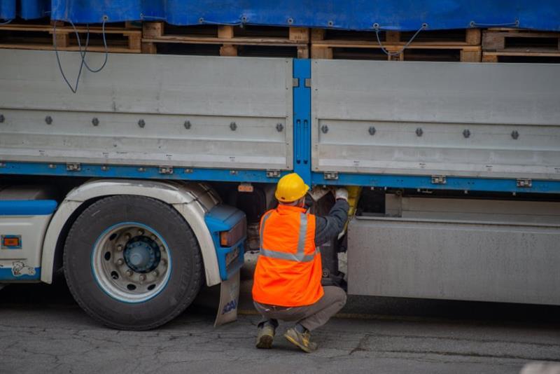 Man inspecting truck