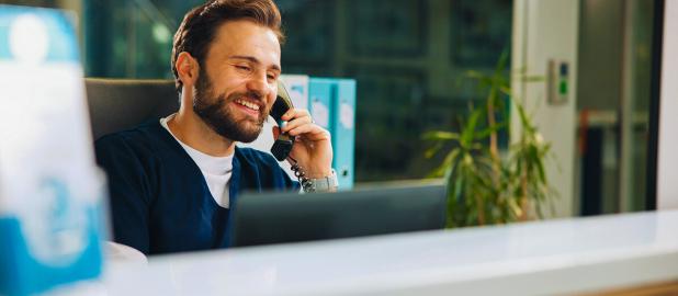 A person in front of laptop in a phone call